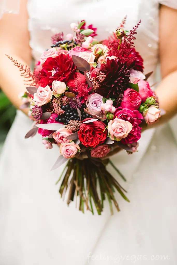bride holding wedding bouquet of flowers