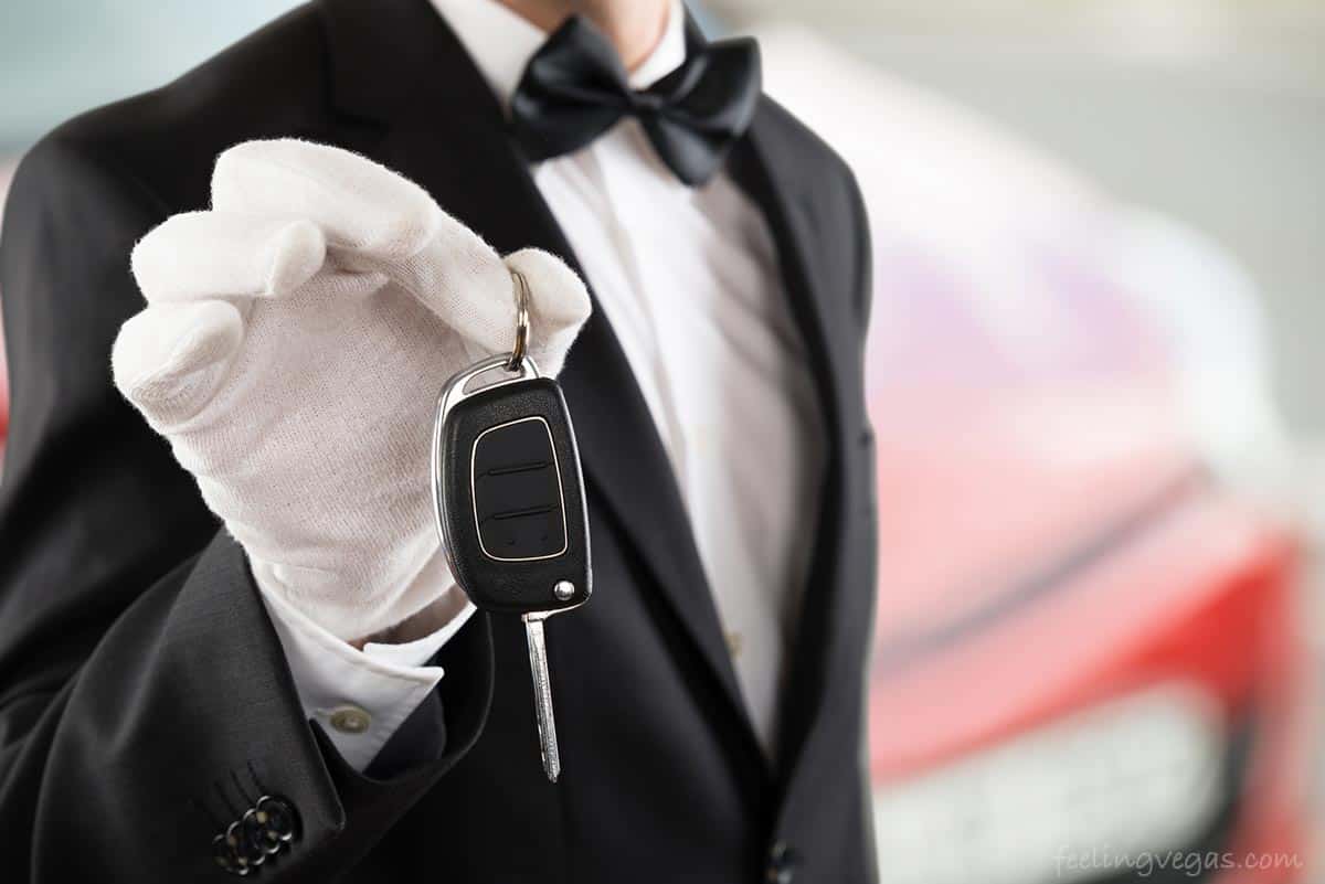 valet holding car key - Tipping Etiquette in Las Vegas