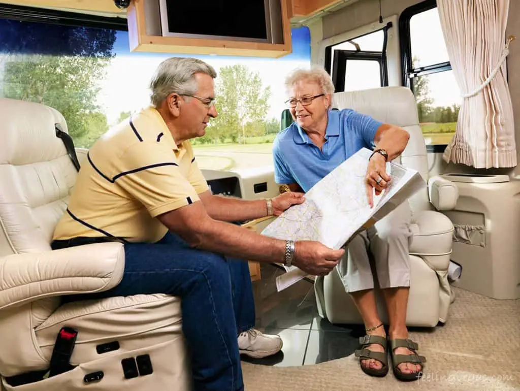 couple looking at map in rv