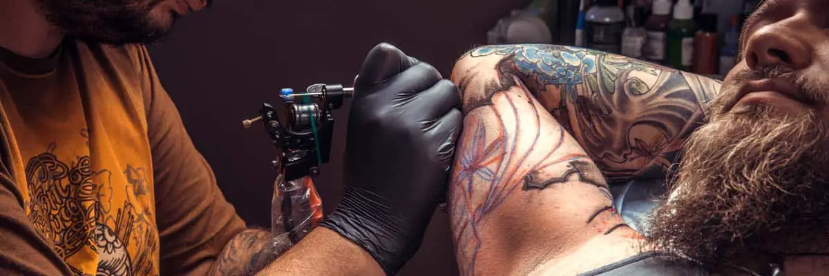 Club Tattoo in Las Vegas: man getting a tattoo in las vegas