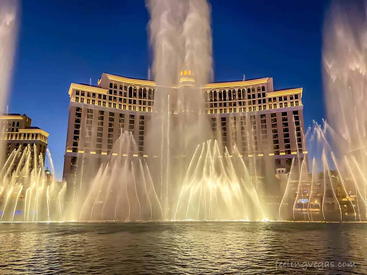 Dining with a view of Bellagio Hotel and fountains at night, Las Vegas