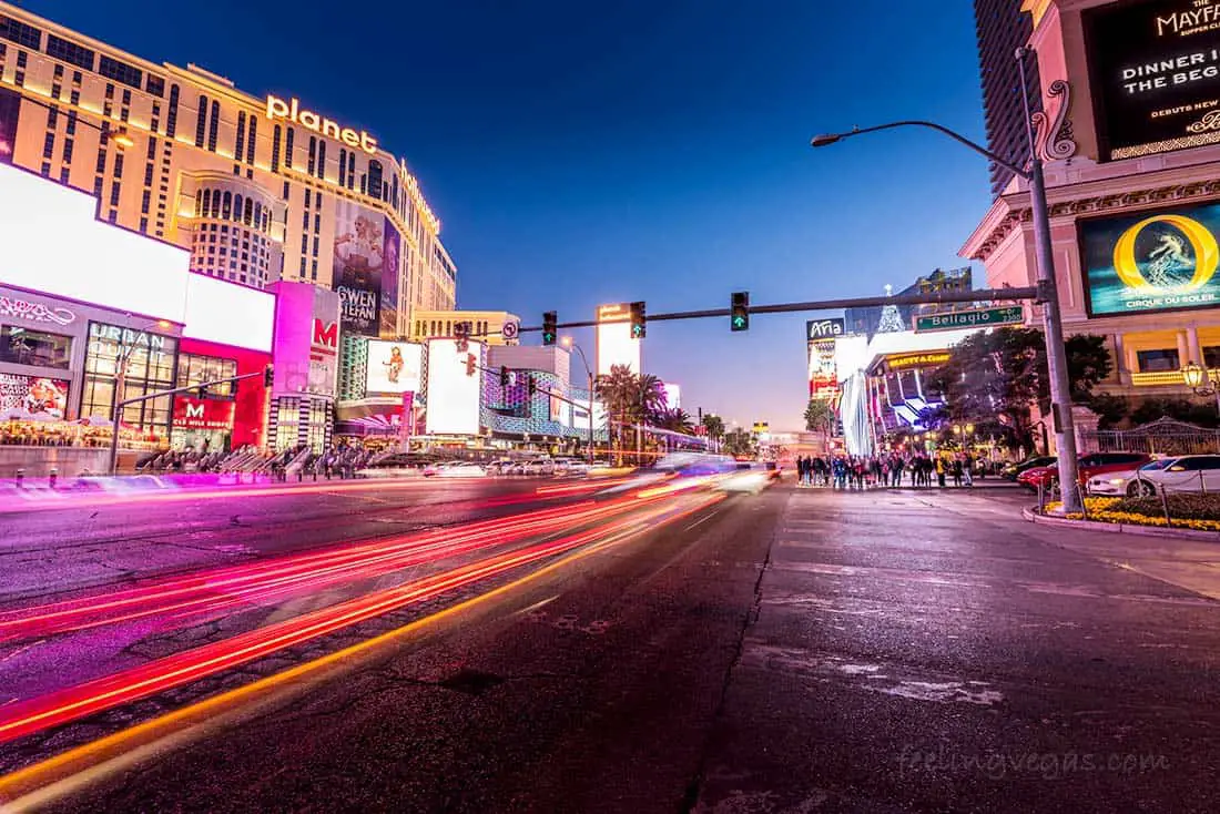 The Las Vegas Strip with traffic and pedestrians at night