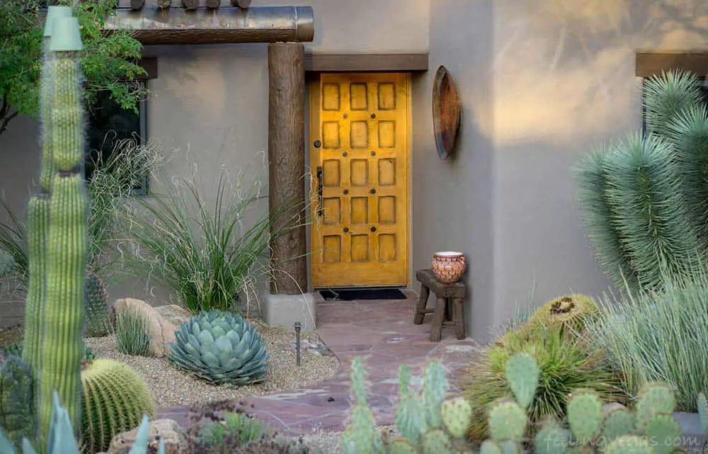 Home and yard with easy to maintain desert landscaping.