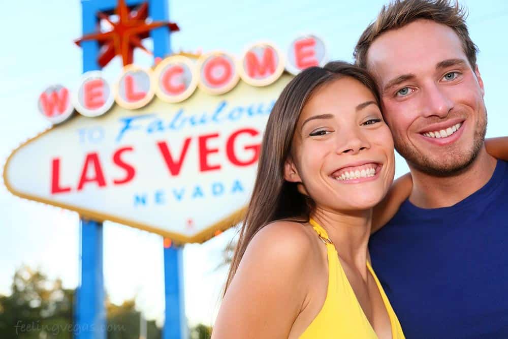 Couple in front of Vegas sign: Romantic things to do in Las Vegas for couples