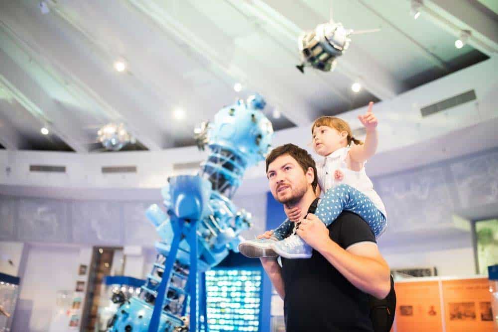 Father and daughter in science museum