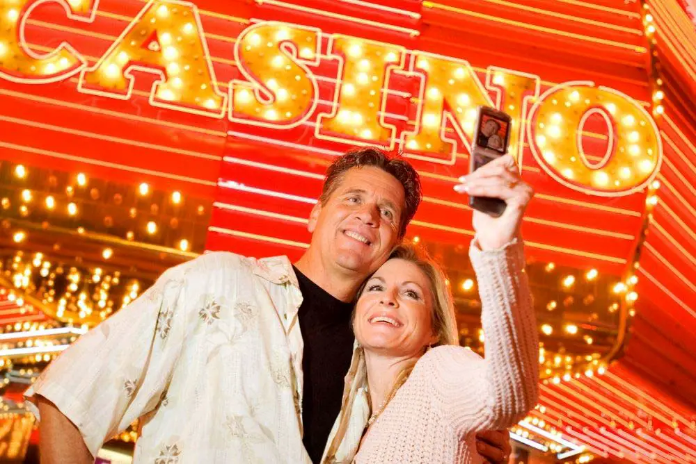 Couple taking selfie pictures at a Las Vegas casino