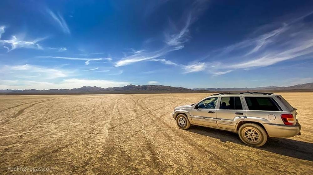 An SUV driving at Jean Dry Lake Bed.