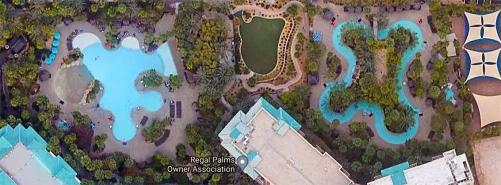 Aerial view of Tahiti Village lazy river and pool area.