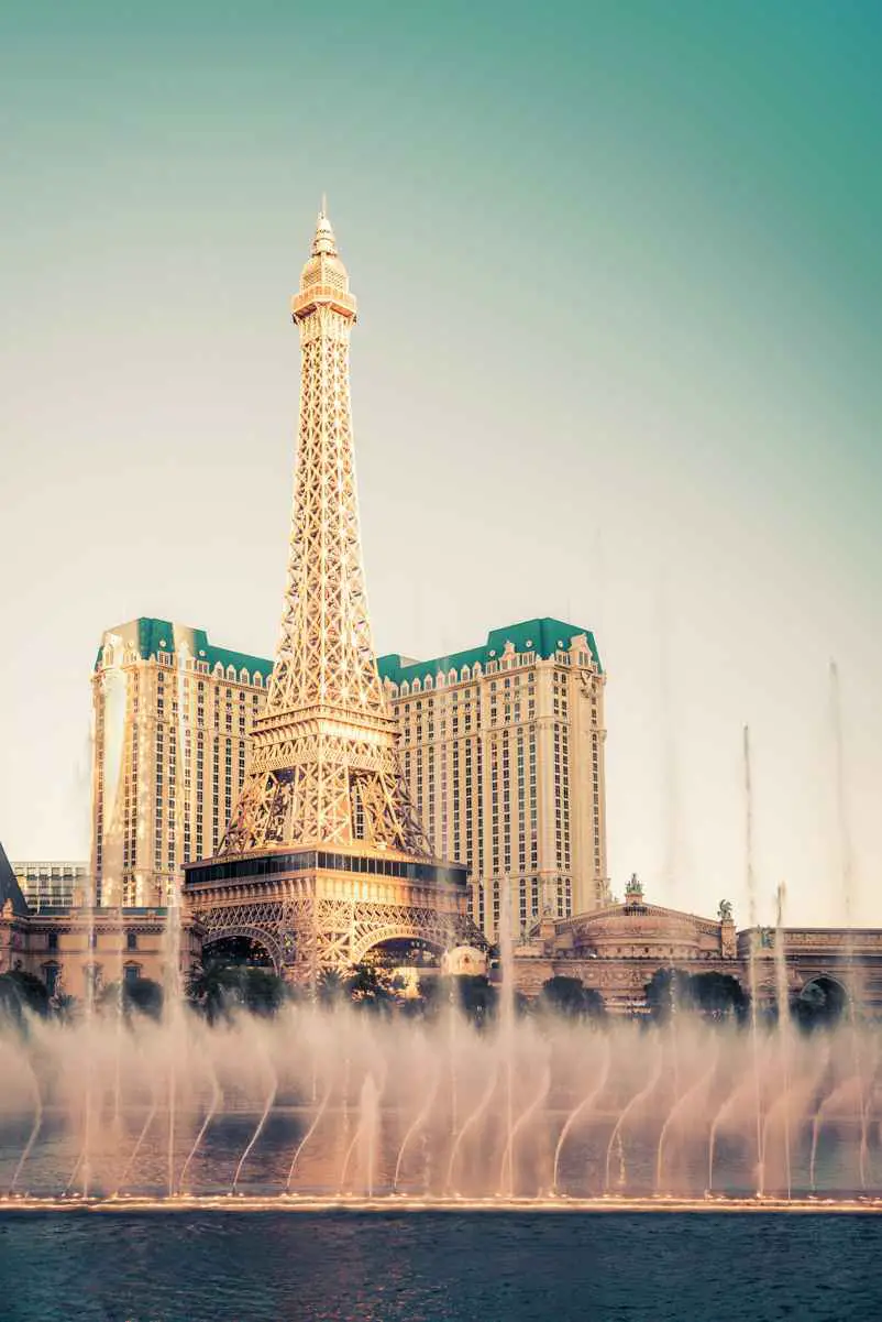 view of bellagio fountain water show and paris las vegas