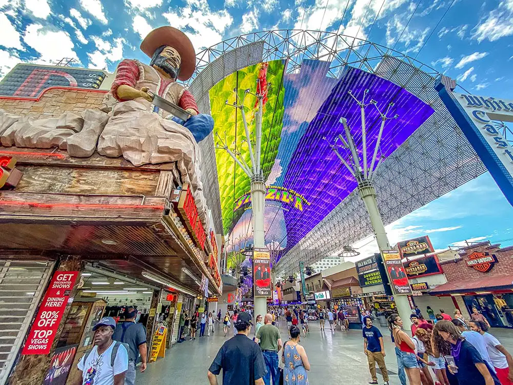 To enjoy Fremont Street like these people, you'll first need to find downtown Las Vegas parking.