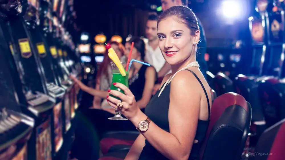 Woman with drink in casino: drink costs in Las Vegas