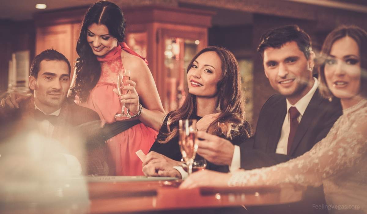 A group of gamblers enjoying champagne in a Vegas casino while playing