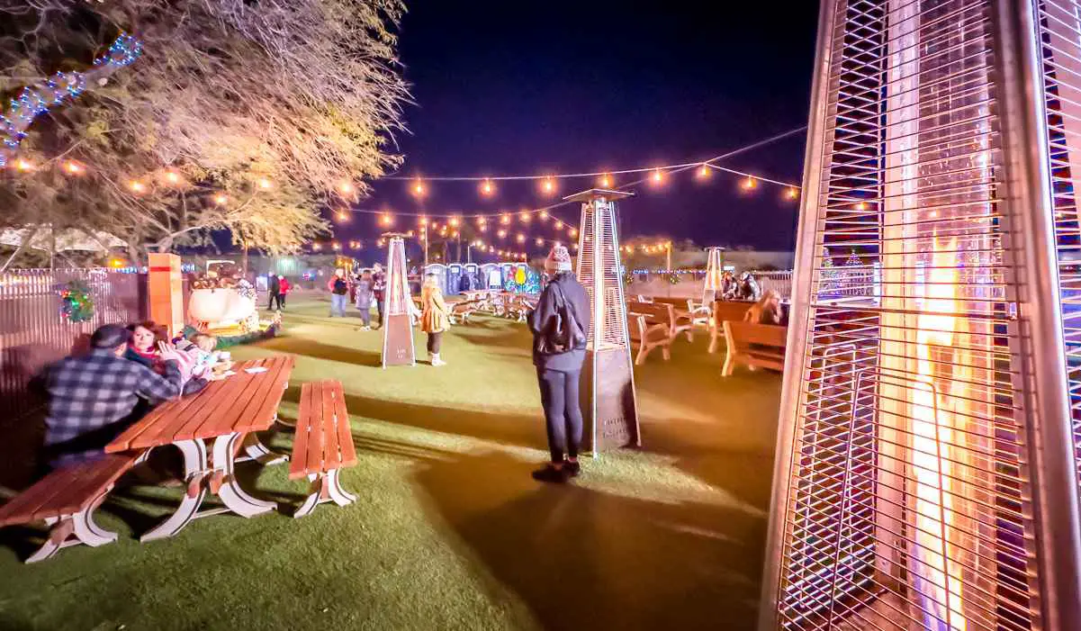 tables and outdoor heaters at Ethel M holiday cactus garden