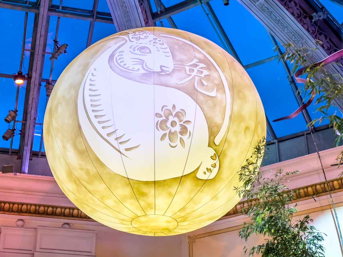 A glowing jade rabbit moon hangs over the Bellagio Conservatory 2023 Lunar New Year celebration