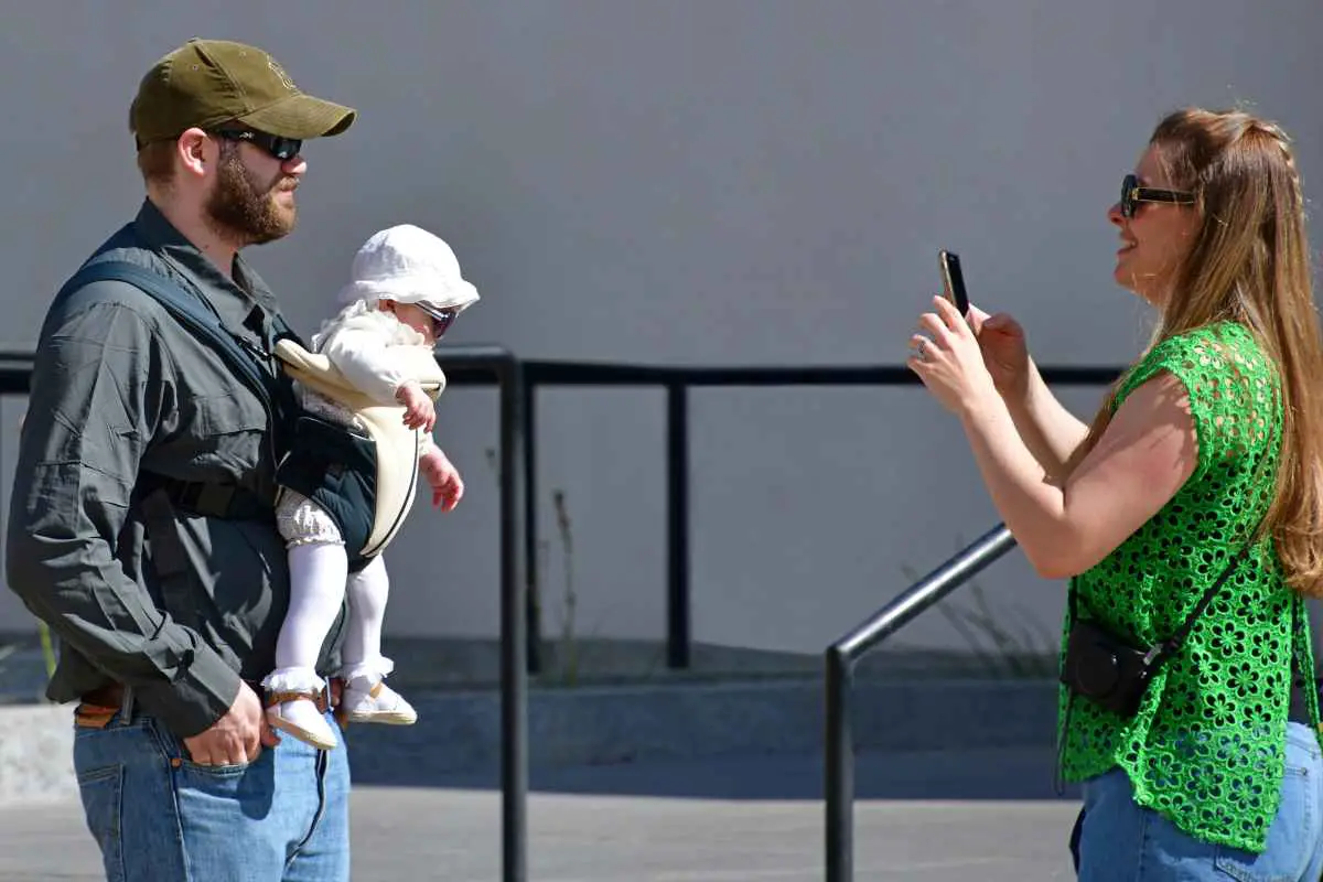 Vegas With a Baby: How To Get Around & Have a Great Time! 3 couple with a baby in a carrier Las Vegas