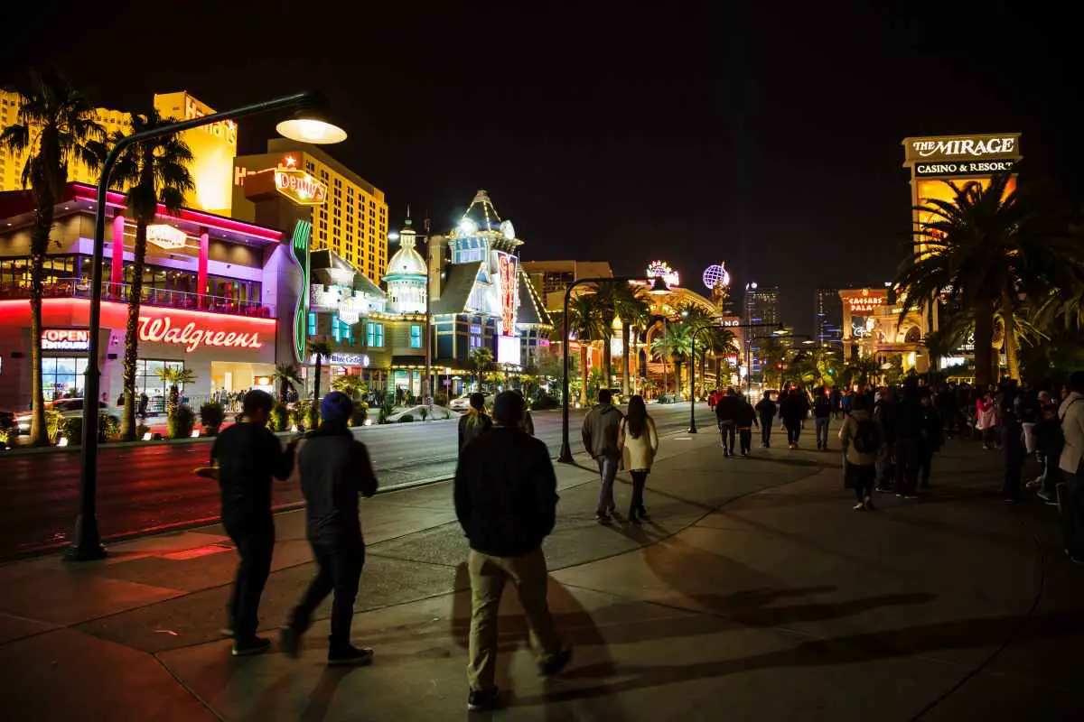 Tourists walking on the Las Vegas Strip at night in January. Note the long pants, jackets, and hats.