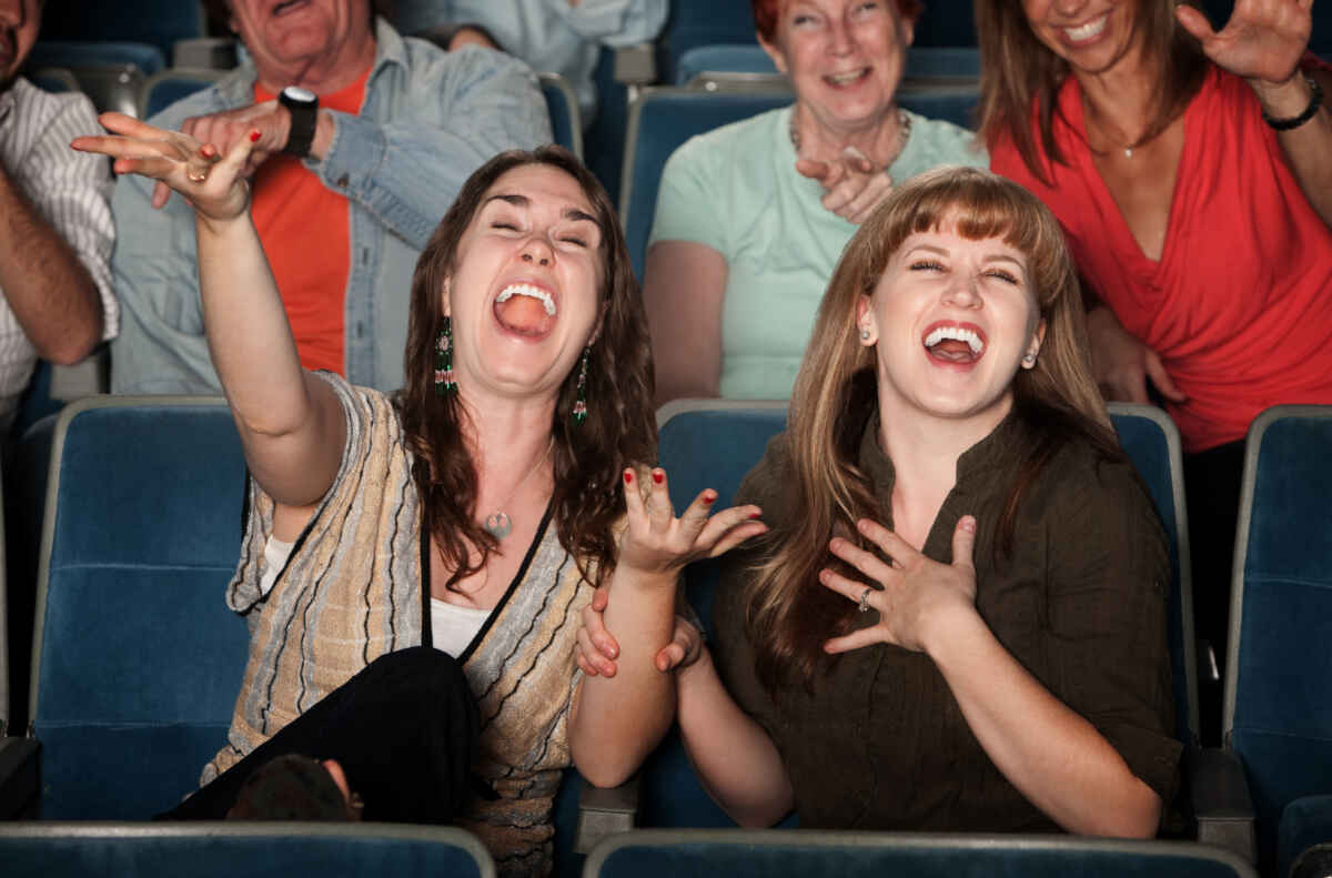 Audience laughing at a Las Vegas comedy show.