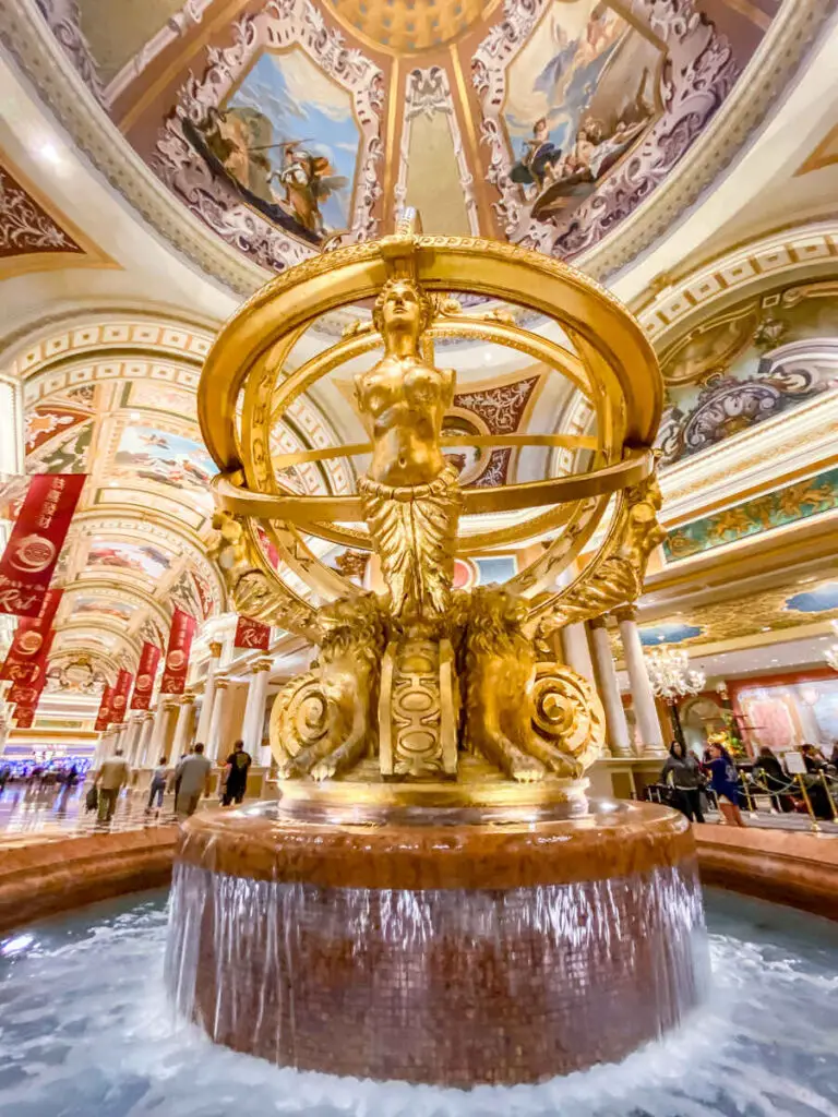 How to Experience Luxury in Las Vegas Without Breaking the Bank 8 Golden fountain in The Venetian lobby near the front desk.