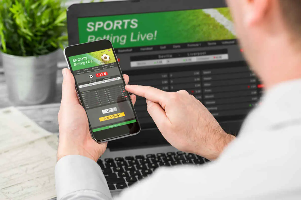 Man using sports betting app